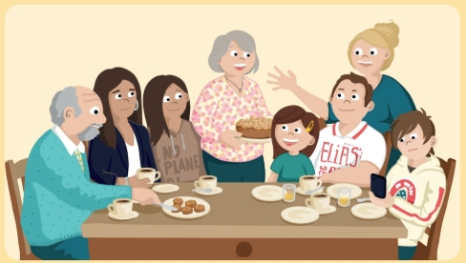 Familie aus mehreren Generationen versammelt um den Küchentisch